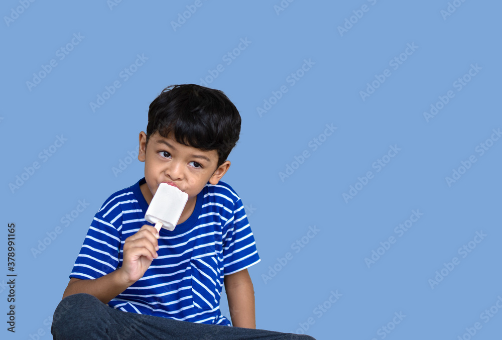 Little Thai boy eating white chocolate Ice cream Little Thai boy eating white chocolate Ice cream