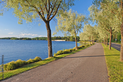 Walking path by the lake shore in Lappeenranta, Finland photo