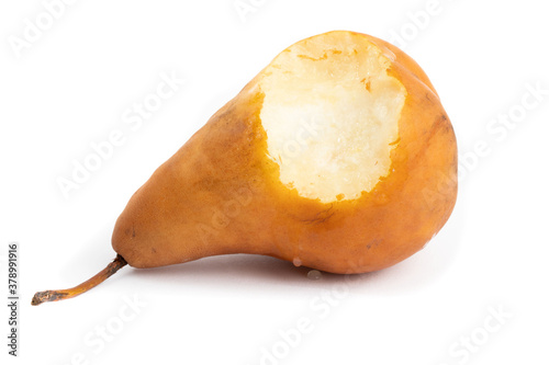 a juicy Bosc pear with a bite taken out of it isolated on white photo