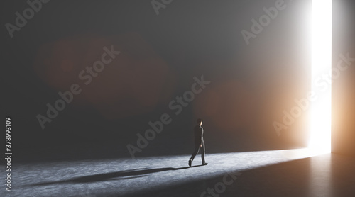 Businessman walking towards an open gate of light.