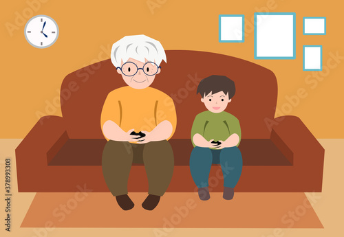 Cross generations grandpa and grandson play game together 