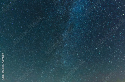 Beautiful starry sky with bright milky way galaxy. Night landscape. Astronomical background.