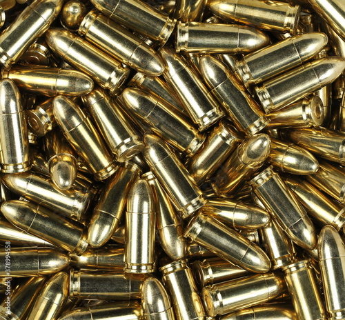 9mm pistol bullet background and texture, top view