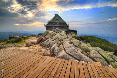 SZKLARSKA POREBA, POLAND - AUGUST 10, 2020: Szrenica mountain shelter (1362 m above sea level) during sunset, Szklarska Poreba, Poland, Europe. photo