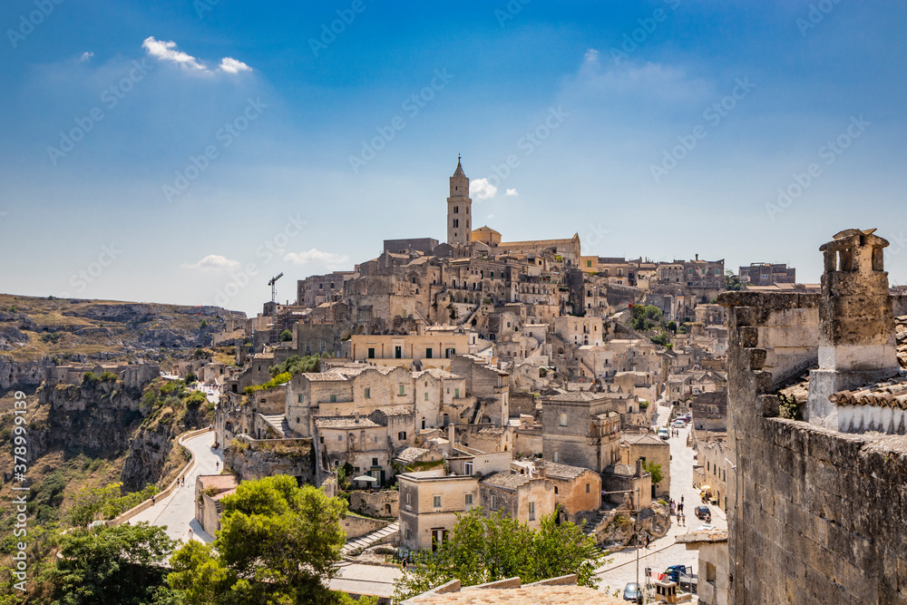 Matera, Basilicata, Italy - Panoramic view of the Civita and the Sasso Barisano. The ancient houses of stone and brick, carved into the rock. The Sassi of Matera.