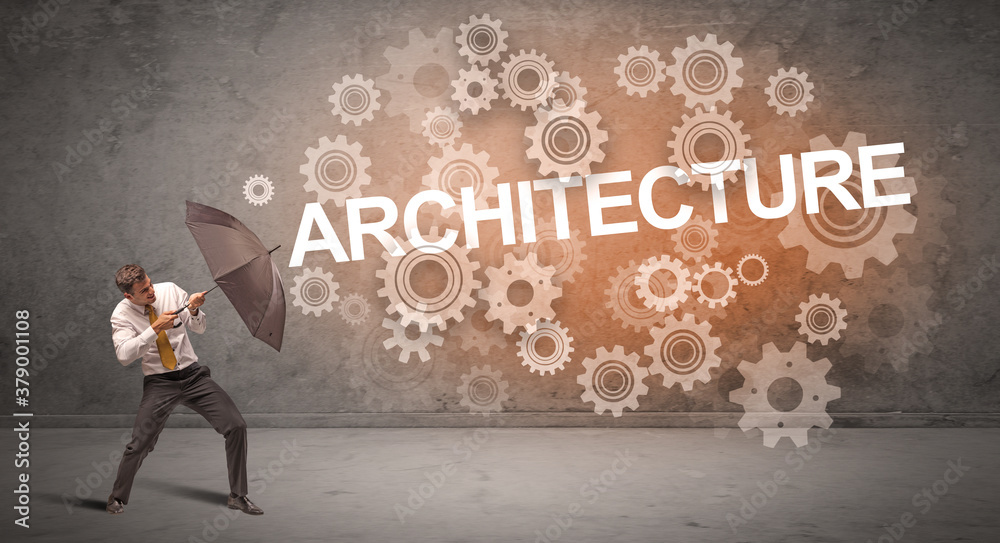Businessman defending with umbrella from ARCHITECTURE inscription, technology concept Businessman defending with umbrella from ARCHITECTURE inscription, technology concept