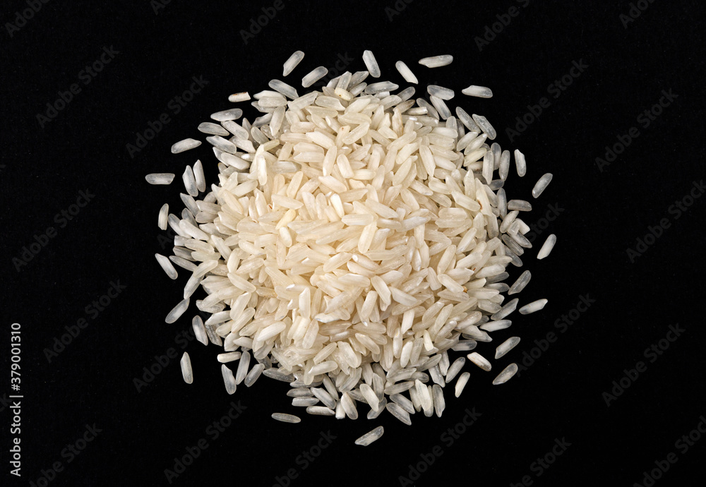 Heap of risotto rice isolated on black background Heap of risotto rice isolated on black background