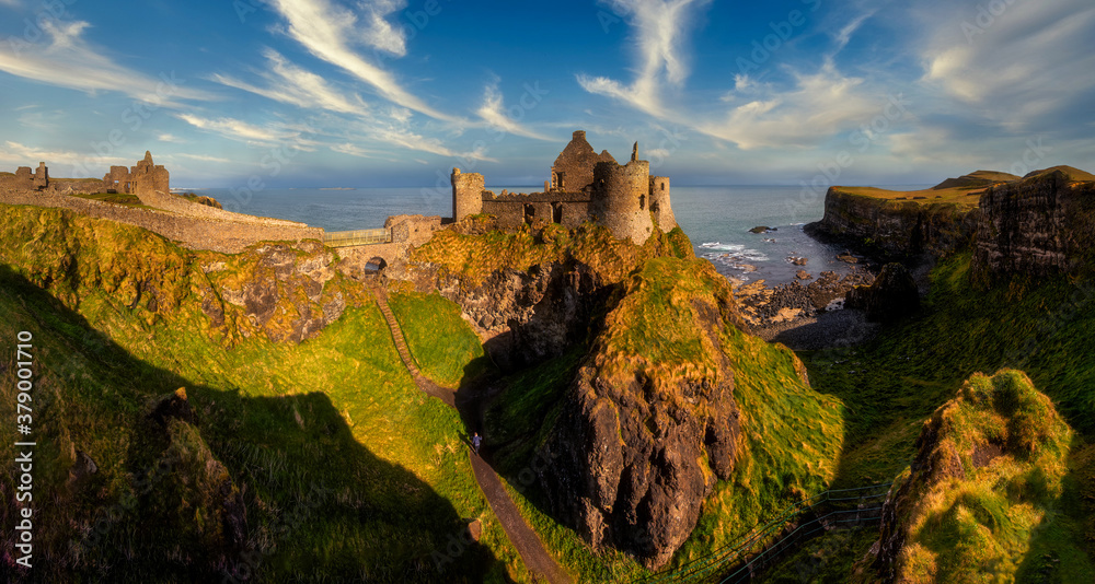 Dunluce Castle is a medieval castle in Bushmills Northern Ireland - big panorama - obrazy, fototapety, plakaty 