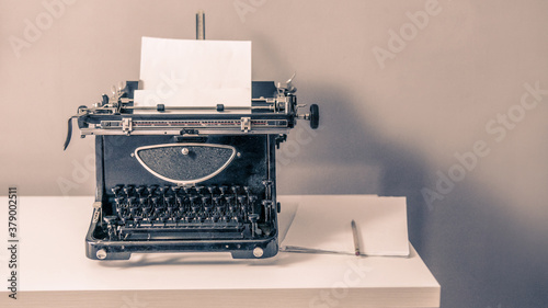 Vintage typewriter's, piles of blank sheets, old-timey writer and blogger concept, insiration