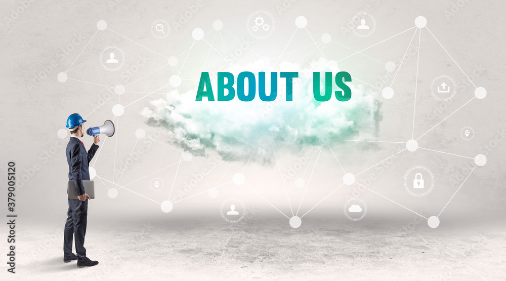 Engineer working on a social media concept with ABOUT US inscription Engineer working on a social media concept with ABOUT US inscription