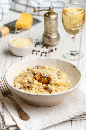 Risotto with porcini mushrooms, Parmesan cheese, Pecorino, onion, garlic, olive oil, dry white wine, freshly ground black pepper and aborio rice. Traditional dish of Mediterranean (Italian) cuisine