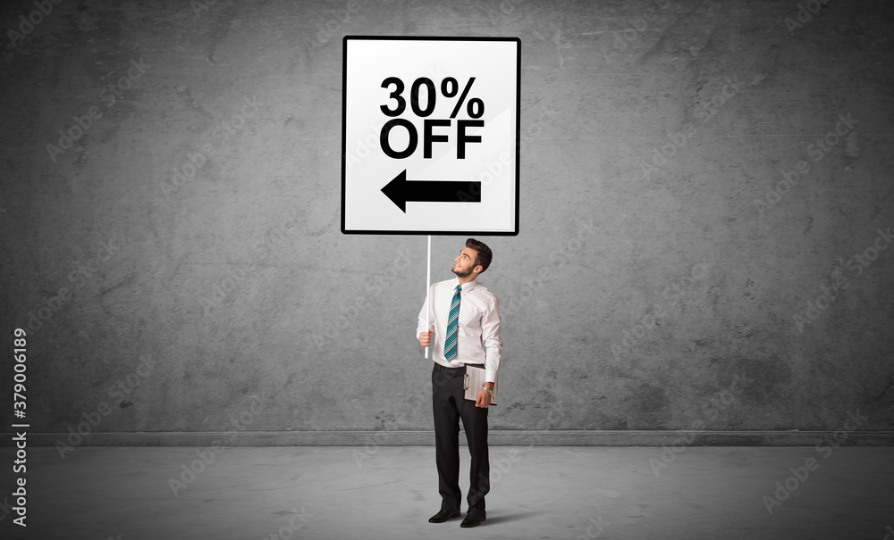 business person holding a traffic sign with 30% OFF inscription, new idea concept business person holding a traffic sign with 30% OFF inscription, new idea concept
