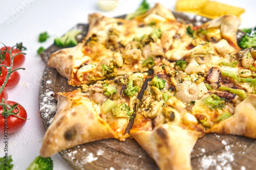 Seafood Italian pizza with mussels, prawn, mozzarella cheese and mushrooms