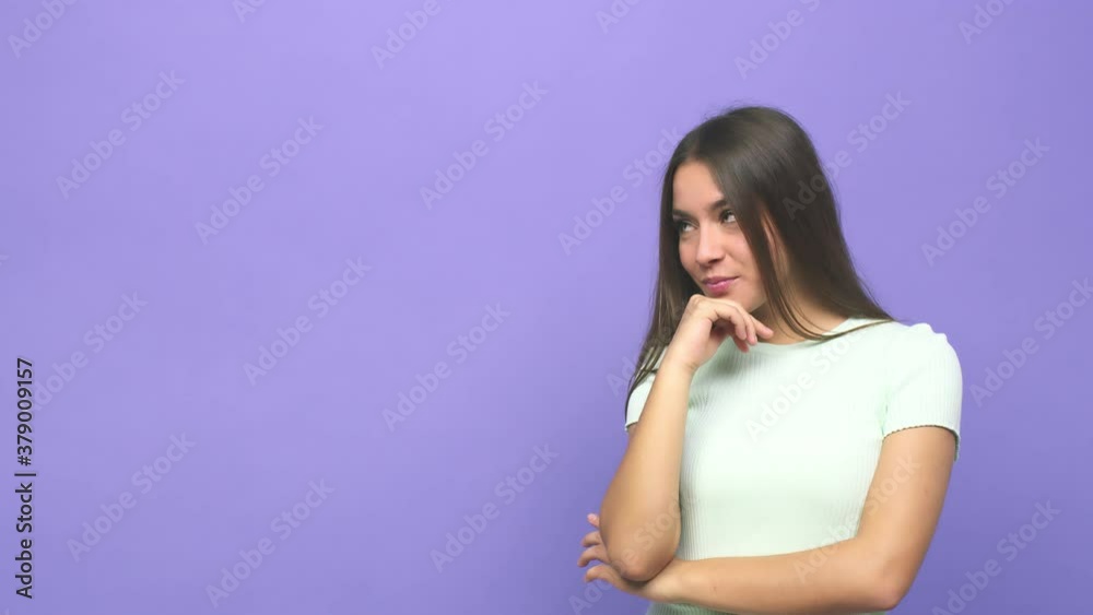 Young cute woman looking sideways with doubtful and skeptical expression Young cute woman looking sideways with doubtful and skeptical expression