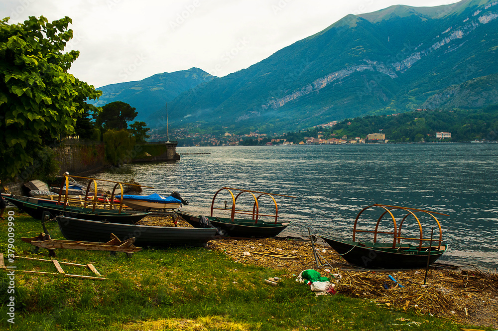 Traditional fishing boats or lucies pulled onto the shore in Loppia on Lake Como  in northern Italy