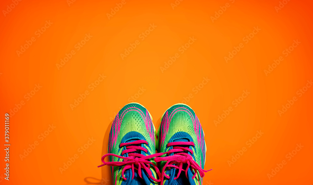 Pair of sport shoes with pink laces - flat lay
