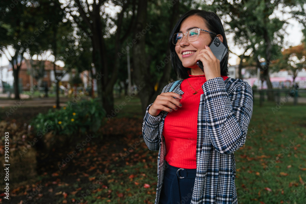 Woman in a call with smartphone Woman in a call with smartphone
