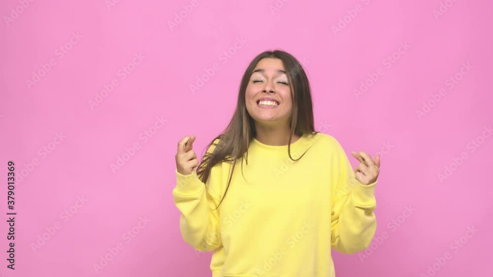 Young cute woman crossing fingers for having luck Young cute woman crossing fingers for having luck