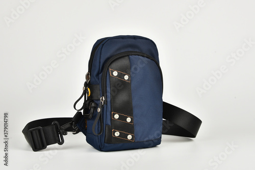 A small shoulder bag for documents and small items on a white background. A must have accessory for travel. photo