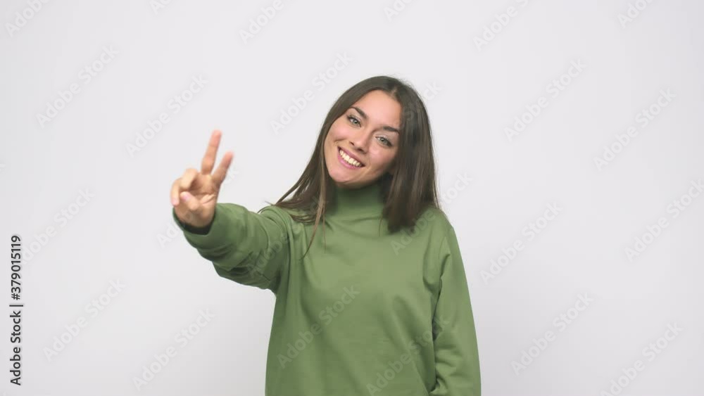 Young cute woman showing number two with fingers Young cute woman showing number two with fingers
