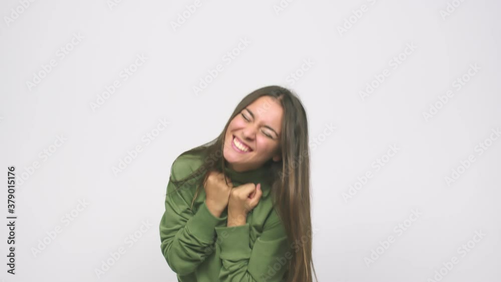 Young cute woman cheering carefree and excited victory concept