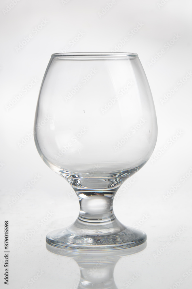 empty glass for cognac on white background empty glass for cognac on white background