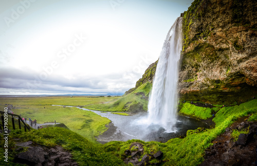 The photo shows beautiful Seljalandfoss waterfall in Iceland.