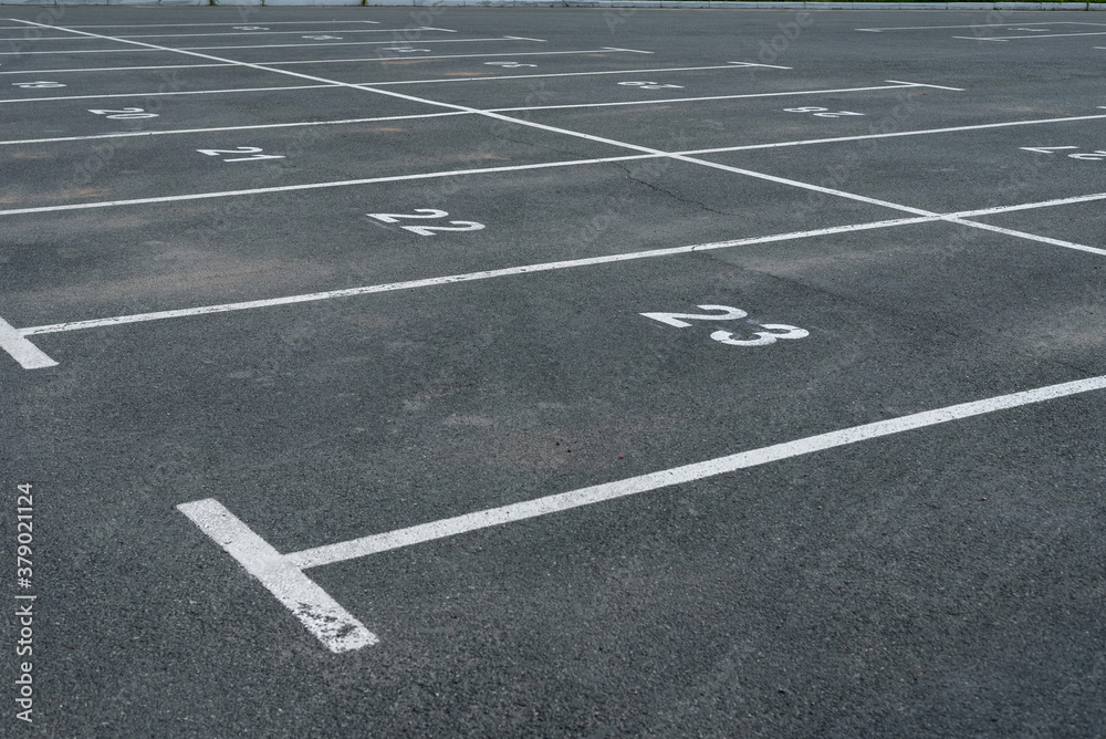 White markings and numbering in the Parking lot.