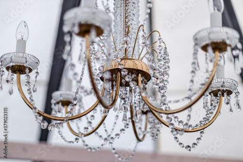 Contemporary crystal chandelier in room interior