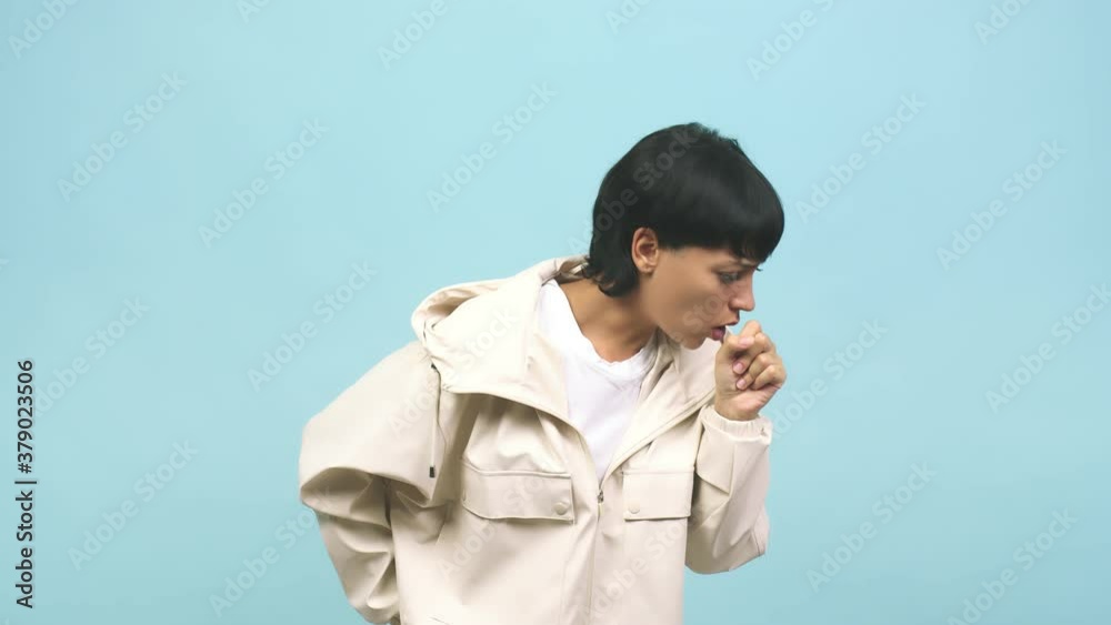 Young caucasian woman coughing, concept of virus or disease Young caucasian woman coughing, concept of virus or disease