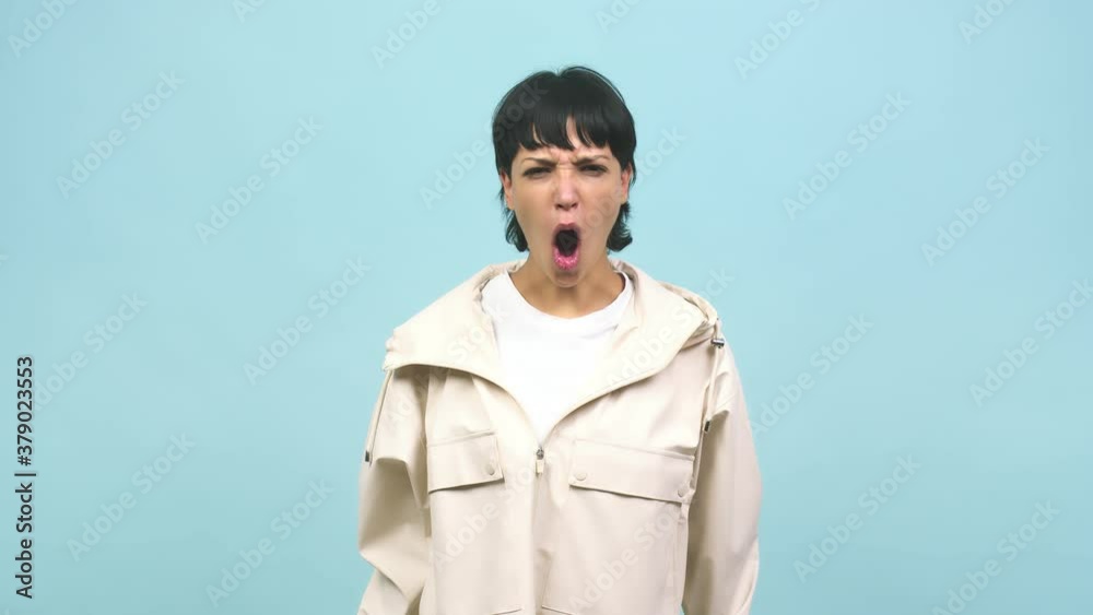 Young caucasian woman screaming angry, expression of madness and mental instability, madness concept Young caucasian woman screaming angry, expression of madness and mental instability, madness concept