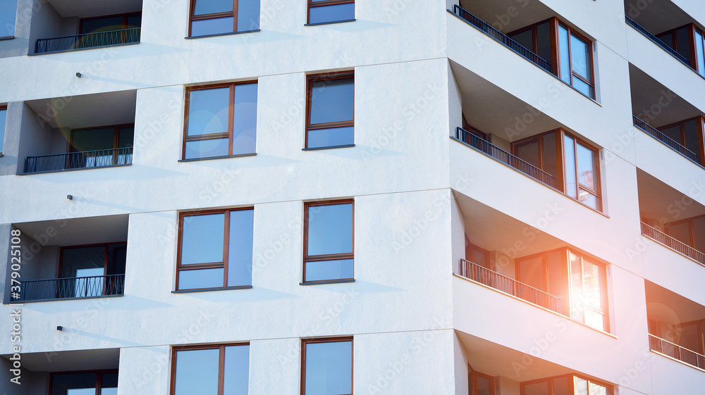 Architectural details of modern apartment building. Modern european residential apartment building complex. Sunset. Architectural details of modern apartment building. Modern european residential apartment building complex. Sunset.
