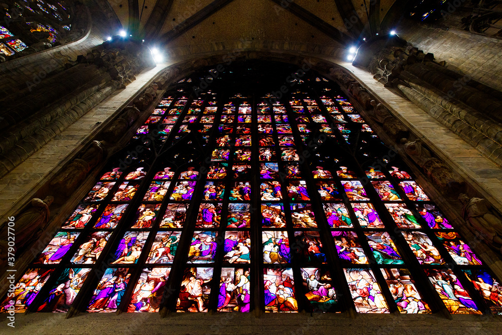 Obraz premium Milan, Italy September 19, 2019. Stained glass in interior Milan Cathedral Duomo di Milano (Cattedrale di Santa Maria Nascente) Metropolitan Cathedral-Basilica of the Nativity of Saint Mary