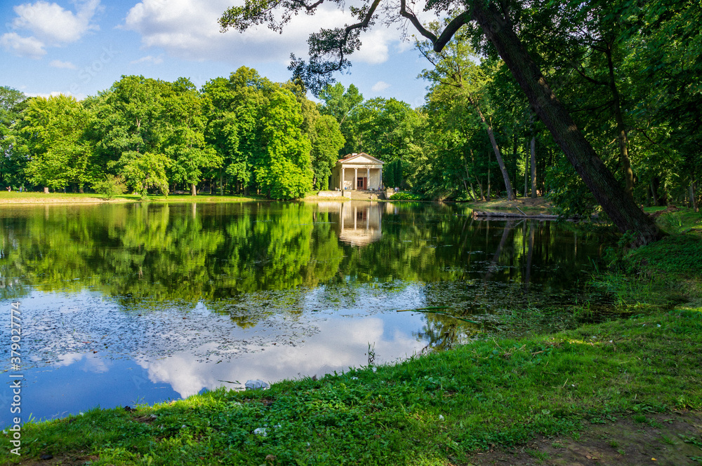 Romantic scenery with a lake, forest and ancient bilding