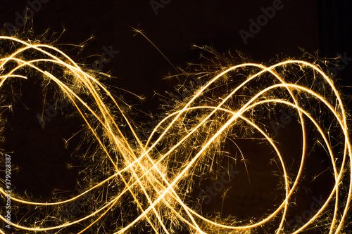 Drawing with light in the dark. An infinity sign is drawn with a burning infinity.