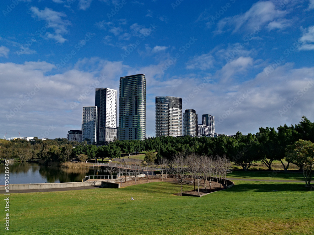 Beautiful view of a lake with reflections of luxury high-rise building, blue sky, clouds, and trees on water, lake Pavillion, Sydney Olympic park, Sydney, New South Wales, Australia
Beautiful view of a lake with reflections of luxury high-rise building, blue sky, clouds, and trees on water, lake Pavillion, Sydney Olympic park, Sydney, New South Wales, Australia