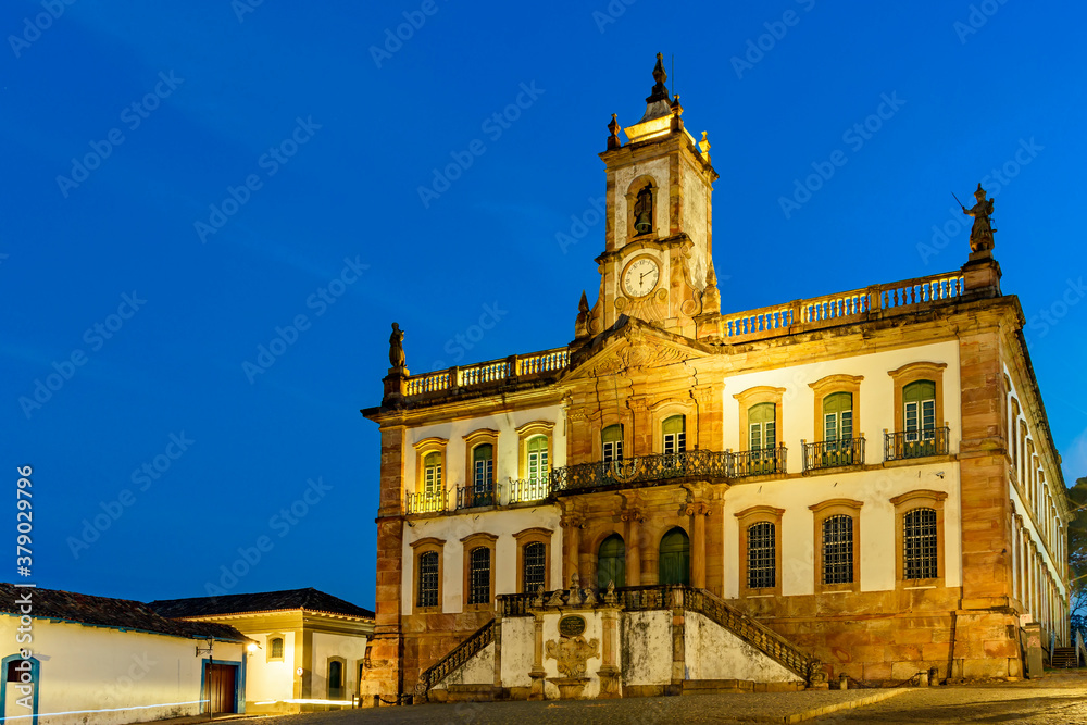 Historic building in Baroque style at dusk in the central square of the city of Ouro Preto in Minas Gerais, Brazil