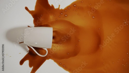 White cup and spilled black coffee on a white background. Top view