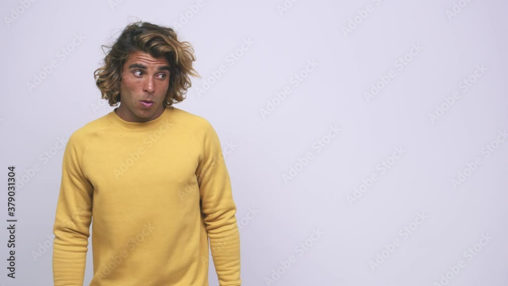 Young cool australian man being shocked because of something she has seen