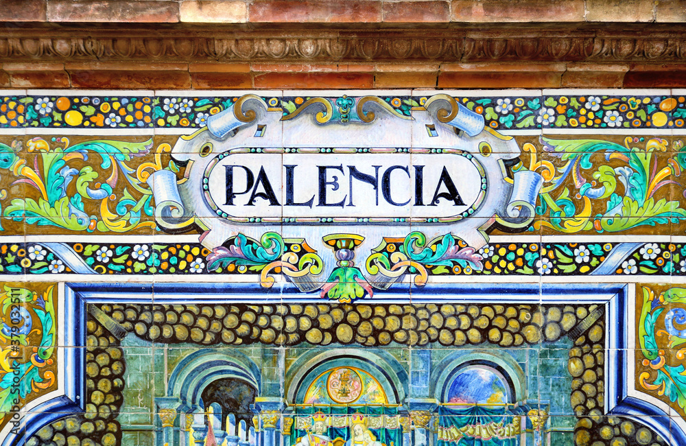 Tile with the name of the spanish city of Palencia on ceramic  with a colorful decoration located in Spain Square in Seville