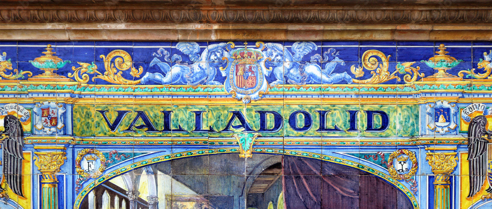 Tile with the name of the spanish city of Valladolid on ceramic  with a colorful decoration located in Spain Square in Seville