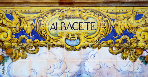 Tile with the name of the spanish city of Albacete on ceramic with a colorful decoration located in Spain Square in Seville