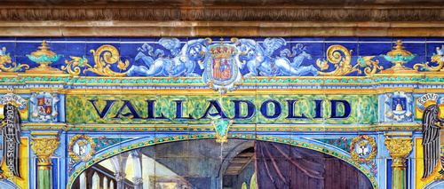 Tile with the name of the spanish city of Valladolid on ceramic with a colorful decoration located in Spain Square in Seville
