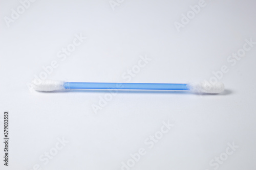 Cotton swab with white background and blue stem