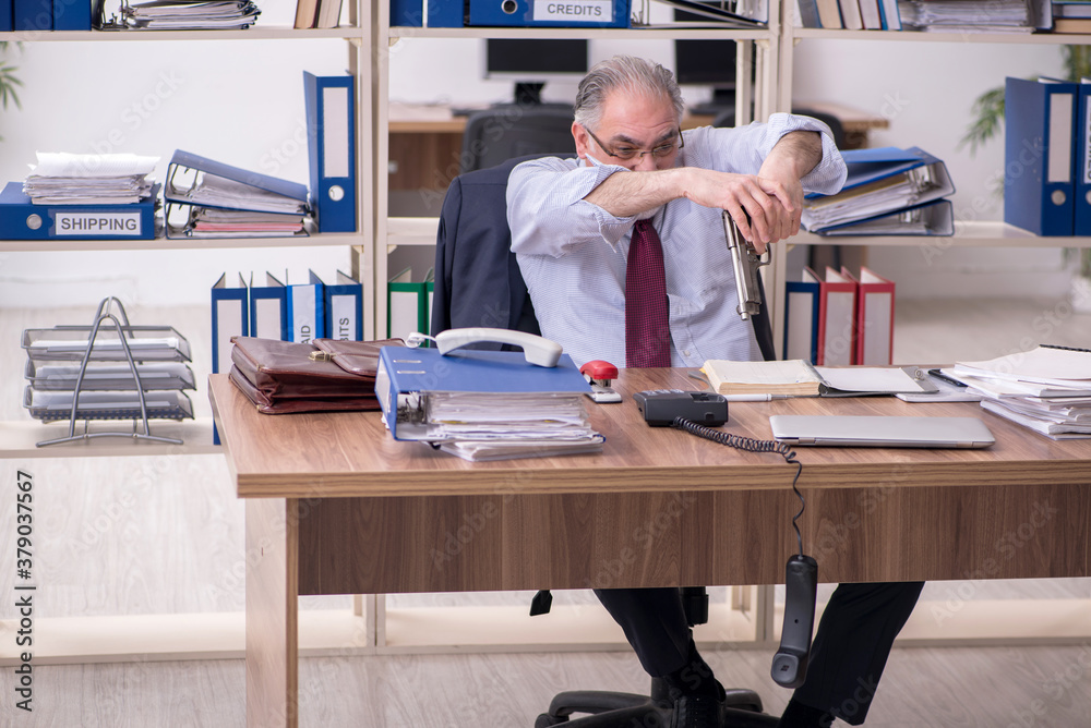 Old male employee unhappy with excessive work Old male employee unhappy with excessive work
