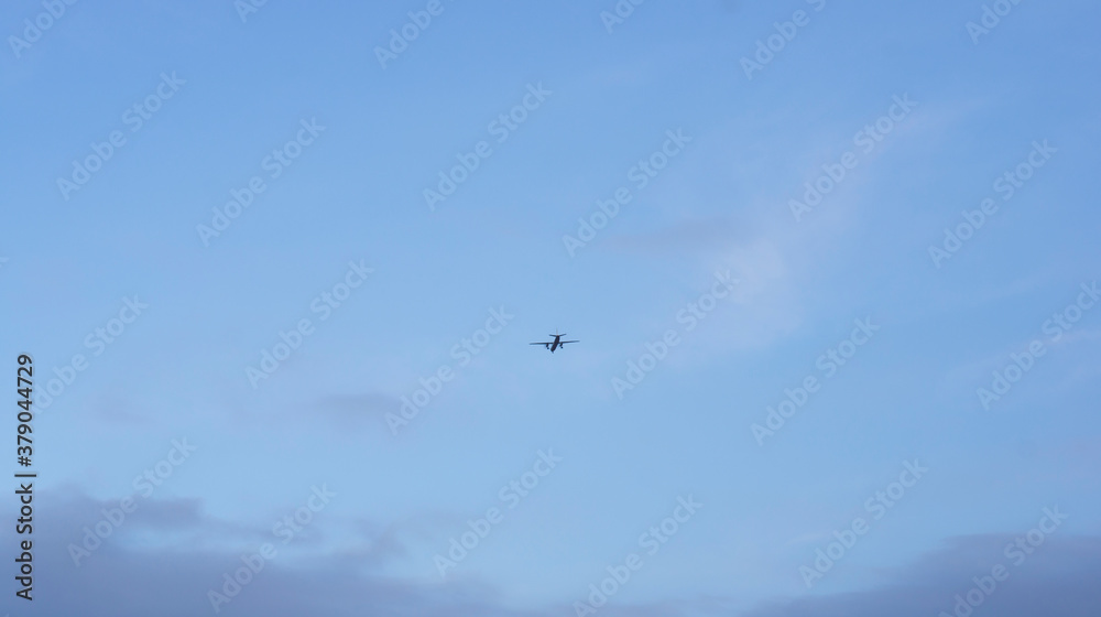 Departing plane in the sky, turboprop plane against the sky.