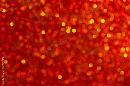 Abstract festive gradient light red bokeh background texture with red bokeh lights. Beautiful backdrop with space for christmas, invitation or other holidays,red background