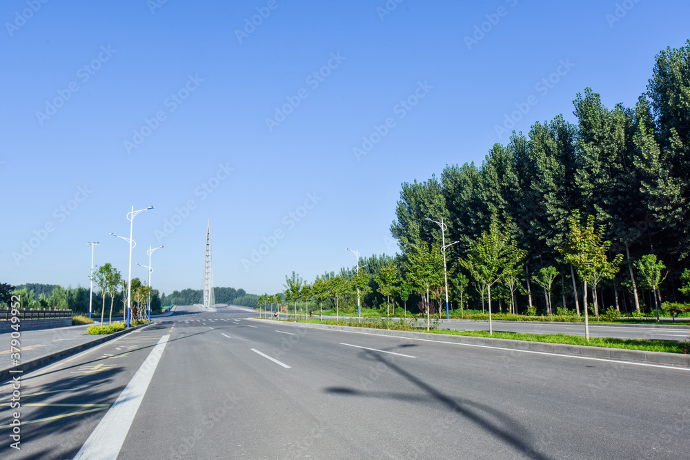Asphalt roads and Bridges, sidewalks, and skylines against a backdrop of blue sky Asphalt roads and Bridges, sidewalks, and skylines against a backdrop of blue sky