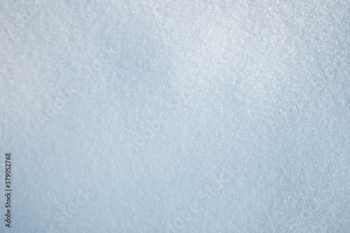 Texture of white snow, the view from the top. Winter solid white background.