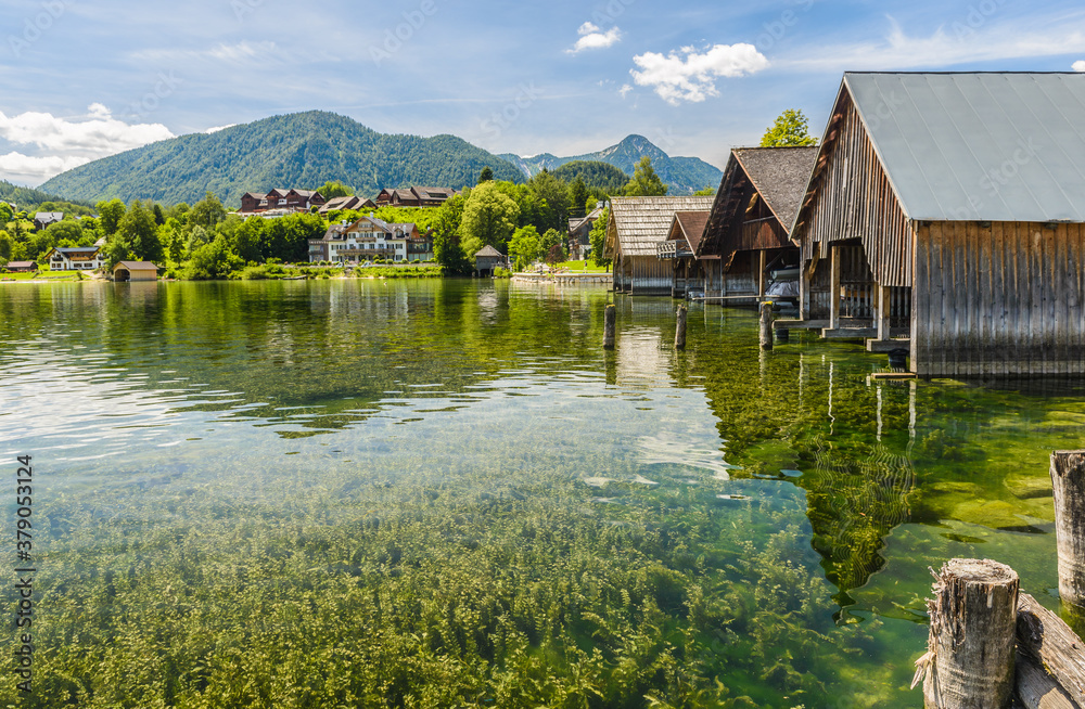 Lake Grundlsee in summer. Village Grundlsee, region Salzkammergut, Liezen district of Styria, Austria, Europe. Lake Grundlsee in summer. Village Grundlsee, region Salzkammergut, Liezen district of Styria, Austria, Europe.